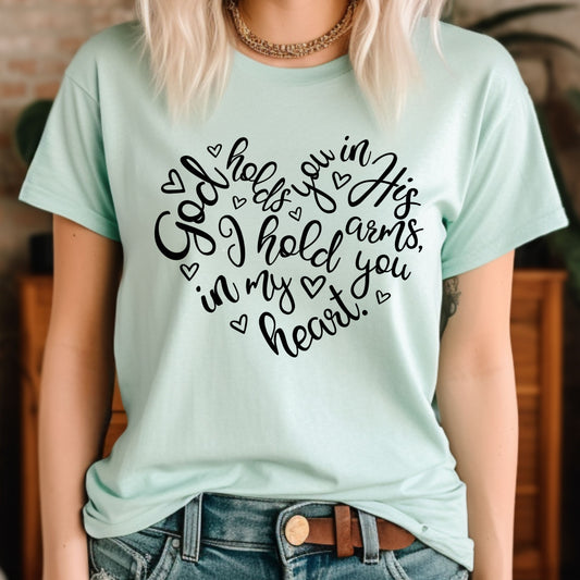 Christian Tee, God Holds you in His Heart Christian T-shirt, woman wearing heather mint colored faith apparel. 
